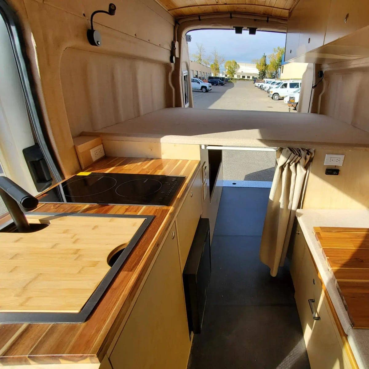 Van kitchen with butcher-block counters and cabinetry